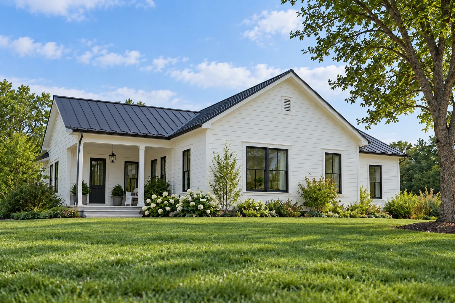 Fictional clapboard house and lawn, used to illustrate daylight and illuminated night views.
